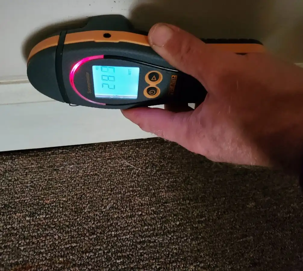 Moisture detection at baseboard during Storm Damage Restoration in Caldwell